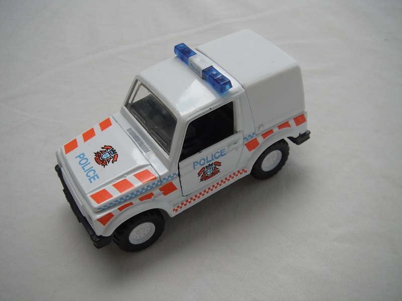 1. White body &amp; canopy/black China base/ten dot dish wheels/clear windows/black interior/blue dome lts/Police, stripes &amp; badge.