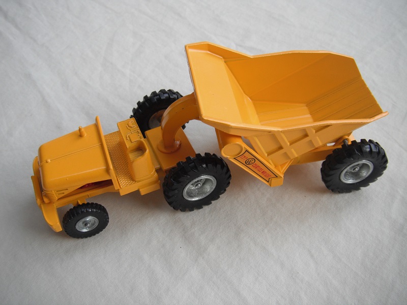 1. Yellow body/Silver metal with black plastic tires/Curtiss Wright decals on dumper's arms.