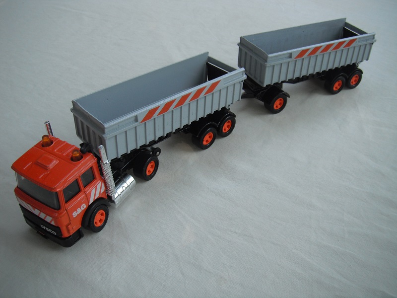 2. Orange cab/black China base/5 spoke mag org whls/clr windows/blk int/Pearly gray trailers/black base/orange stripes.