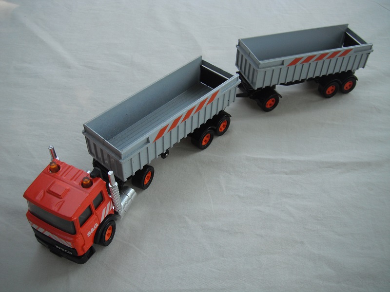 1. Dark orange cab/black Macau base/5 spoke mag org whls/clr windows/blk int/Pearly gray trailers/black base/orange stripes.