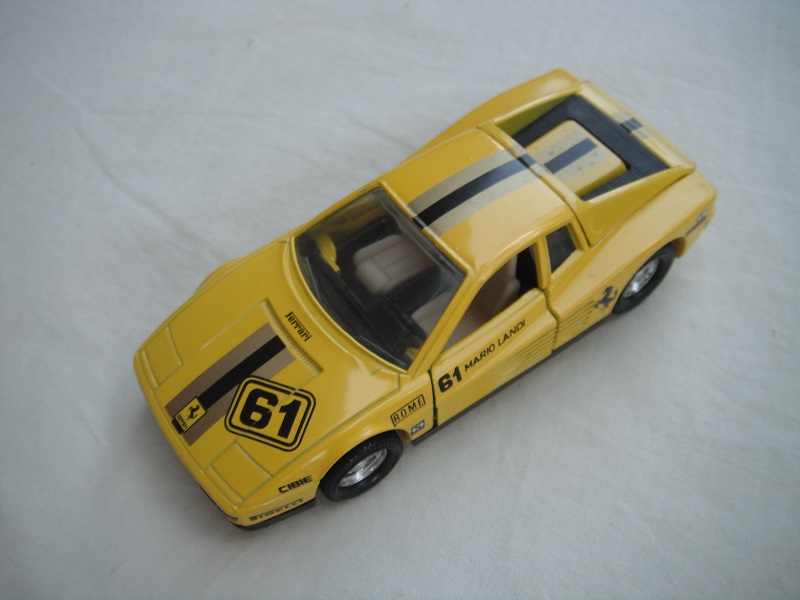 2. Dk.yellow body/yellow  base/5 spoke star disc wheels/clear windows/cream &amp; black int/stripes &amp; &quot;61&quot; tampo.