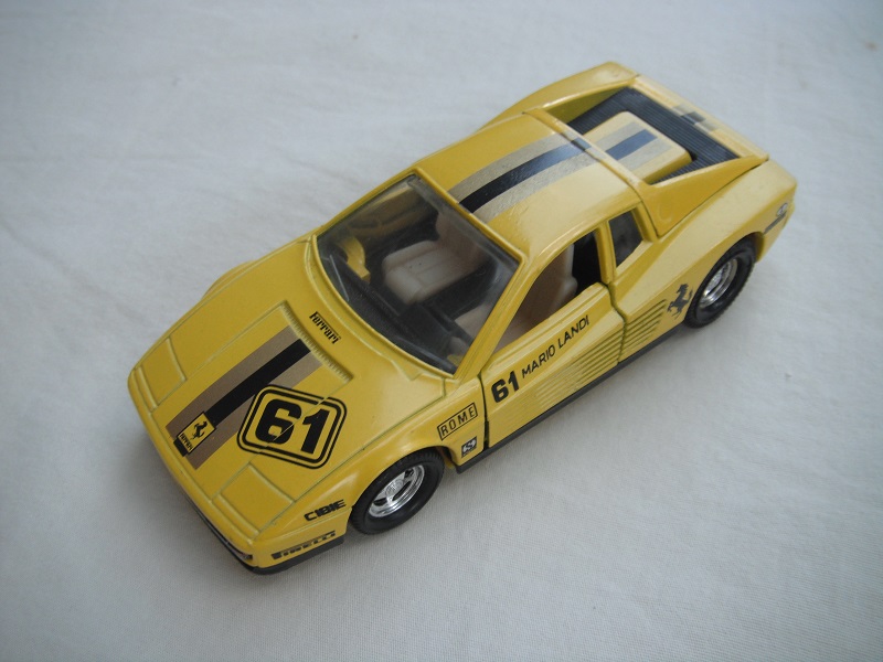 1. Yellow body/yellow base/5 spoke star disc wheels/clear windows/cream &amp; black int/stripes &amp; &quot;61&quot; tampo.