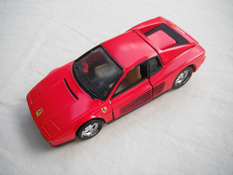 3.  Red body/detailed red plastic Macau base/5 spk star disc whls/clr wind/cream &amp; blk int/Ferrari logo on hood &amp; sides(PP).