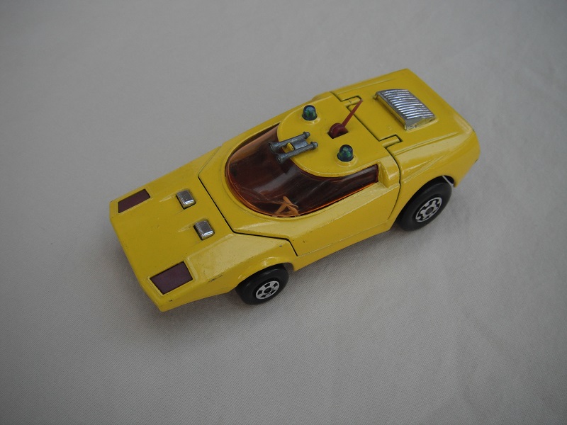 1. Yellow body/flat black base K32/tow guide/burgundy int/amber windshield/blu dome lts/PP.