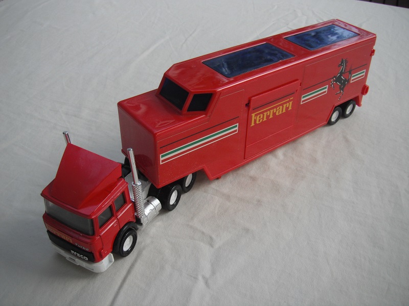 3. Red cab/wht England base/wht 8 dot disc whls/clear windows/black int/red trailer/red England base/brown int/Ferrari.