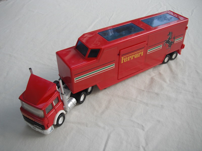 2. Red cab/wht England base/wht 8 dot disc whls/lt.tint windows/white int/red trailer/dk.gray England base/brown int/Ferrari.