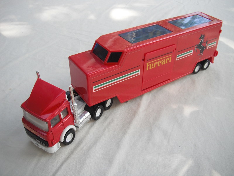 1. Red cab/wht England base/wht 8 dot disc whls/clear windows/white int/red trailer/dk.gray England base/brown int/Ferrari.
