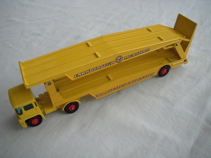 7. Yellow cab/type 2/blk base/yellow trailer/King Size/type a/BPT w/red hubs/red axle spring/one ridge rear of ramp/white letters on decals.