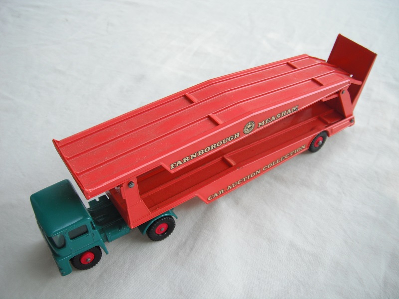 6. Turquoise cab/type 2/blk base/dk.org trailer/King Size/type a/BPT w/red hubs/red axle spring/one ridge rear of ramp/white letters on decals.