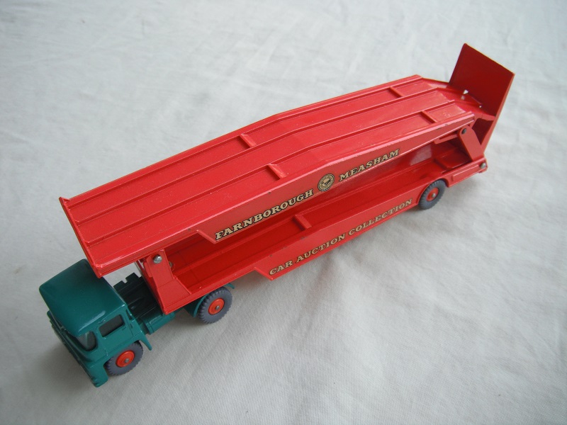 1. Turquoise cab/type 1/blk base/dk.org trailer/King Size/type a/GPT w/org hubs/red axle spring/one ridge rear of ramp/cream upper &amp; wht lower letters on decals.