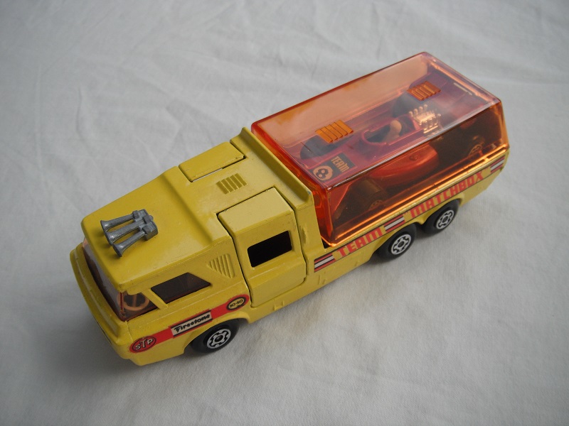 11.Yellow body/orange canopy/red tailgate/sil base/MC whls/amber windows/blk int/chrm lts/Team Matchbox/red MB24B.