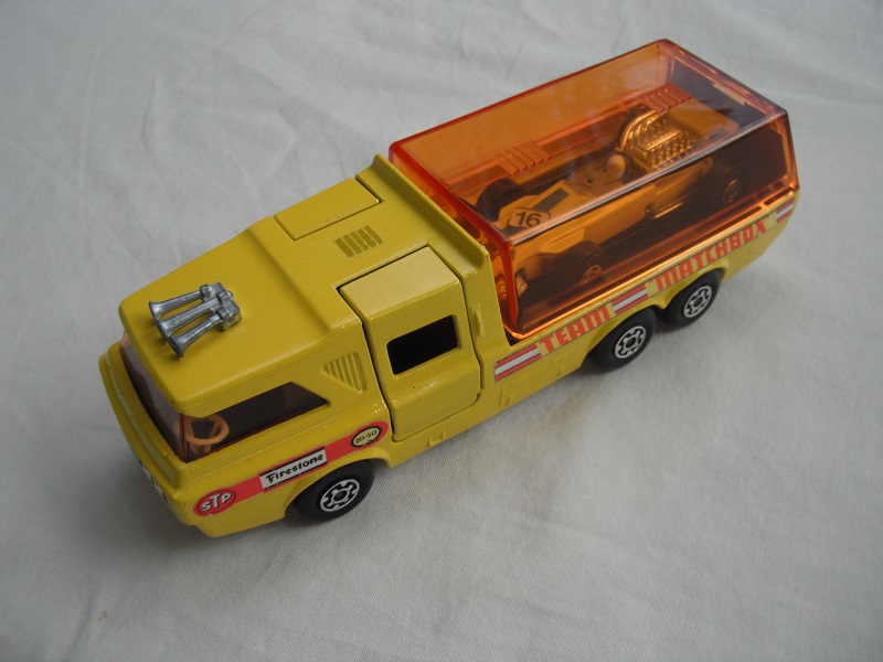 6. Yellow body/orange canopy/dk.red tailgate/sil base/MC whls/amber windows/blk int/chrm lts/Team Matchbox/yellow MB34A.