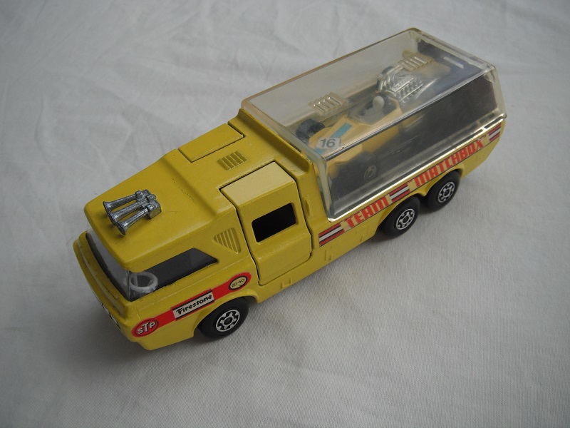 2. Yellow body/clear canopy/dk.red tailgate/sil base/MC whls/clr windows/blk int/chrm lts/Team Matchbox/yellow MB34A.