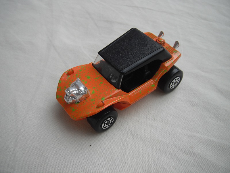 11.Orange body/grn splatter//black roof/orange base/MC wheels/clear windshield/black int/hood ornament.