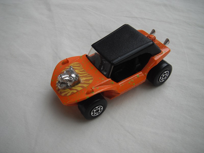 8. Orange body/grn splatter//blk roof/lt.org base/MC whls/clr windshield/blk int/lt.brown stripes &amp; hood ornament.