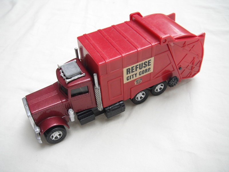 1. Burgundy body/matt black Lesney base/5 spoke mag wheels/clear windows/unpainted AC unit/Refuse City Corp.