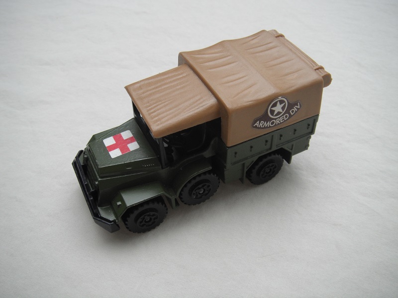8. Olive green body/matt black K112 base/tan canvas top/black MC wheels/Armored Div labels.