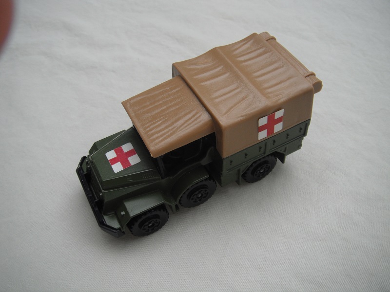 7. Olive green body/flat black K112 base/tan canvas top/black MC wheels/Red Cross labels.
