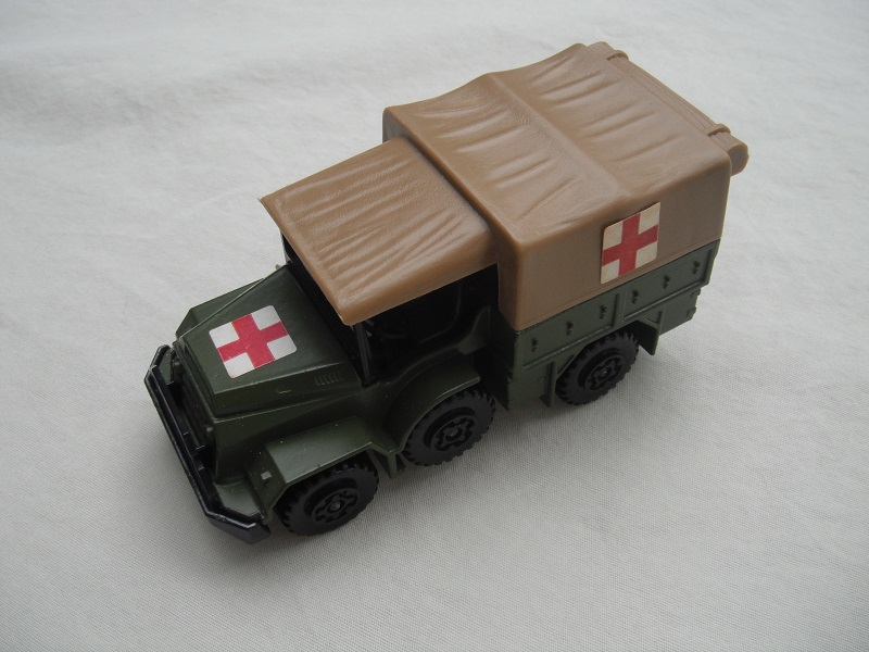 6. Olive green body/matt black K112 base/tan canvas top/black MC wheels/Red Cross labels.