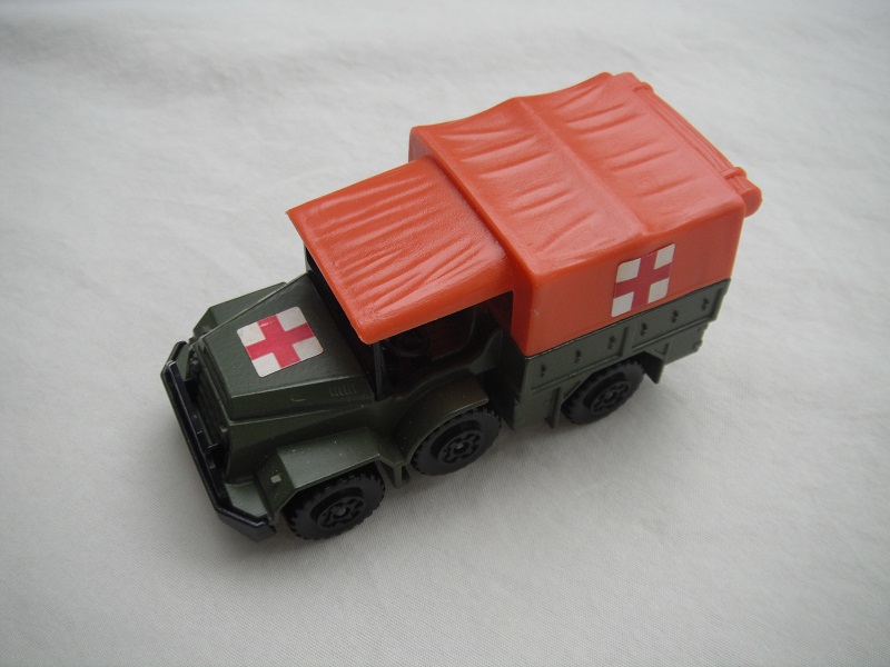 4. Olive drab body/matt black K112 base/orange canvas top/black MC wheels/Red Cross labels.