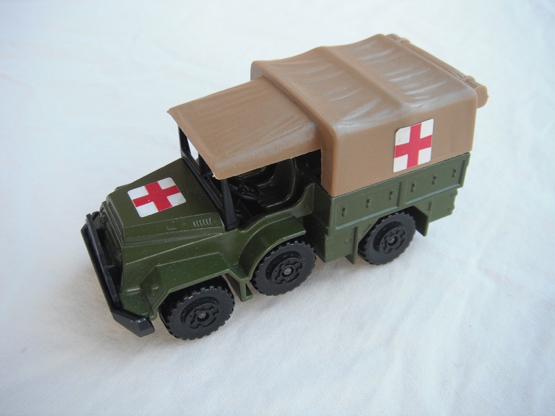 2. Olive green body/matt black BK112 base/tan canvas top/black MC wheels/Red Cross labels/PP.