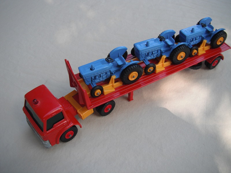 8. Red cab/yel tanks/grn windows/reg whls/bluish xle cvr/red trailer/yel rack/wht xle spring/lt. blu tractors/with Pat No.