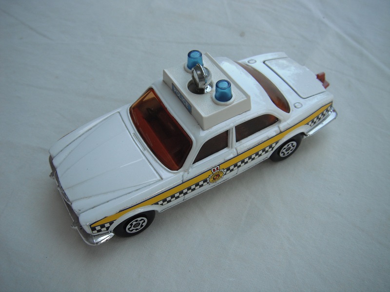 9,  Off white body &amp; base/MC wheels/brown int/amber windows/lt.blue dome lts/Checkers labels &amp; &quot;County Police&quot; badge.