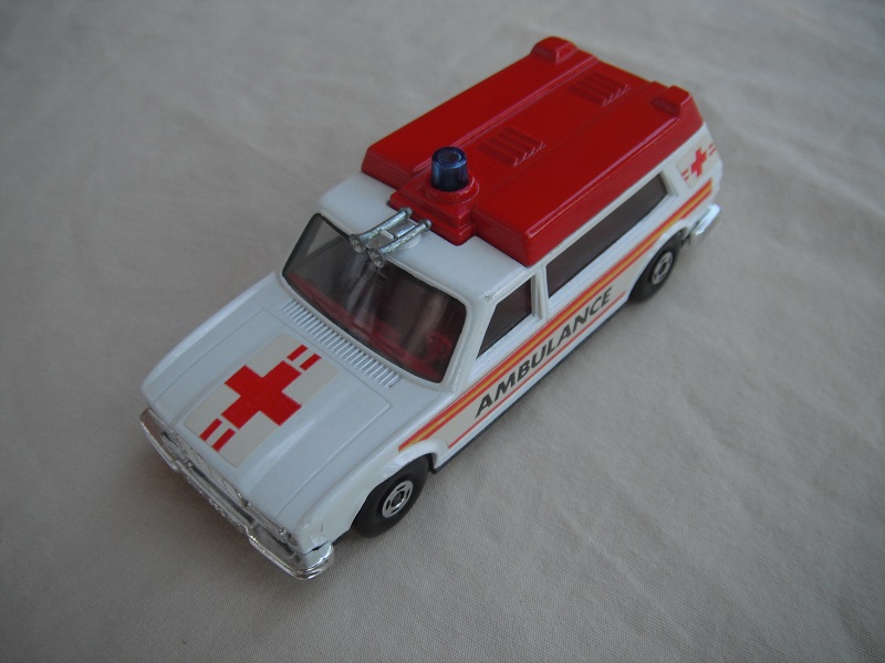 6. White body/dk.red roof/gloss black Speedkings base/lt.blue windows/blue dome light/dk.red interior/ambulance labels.