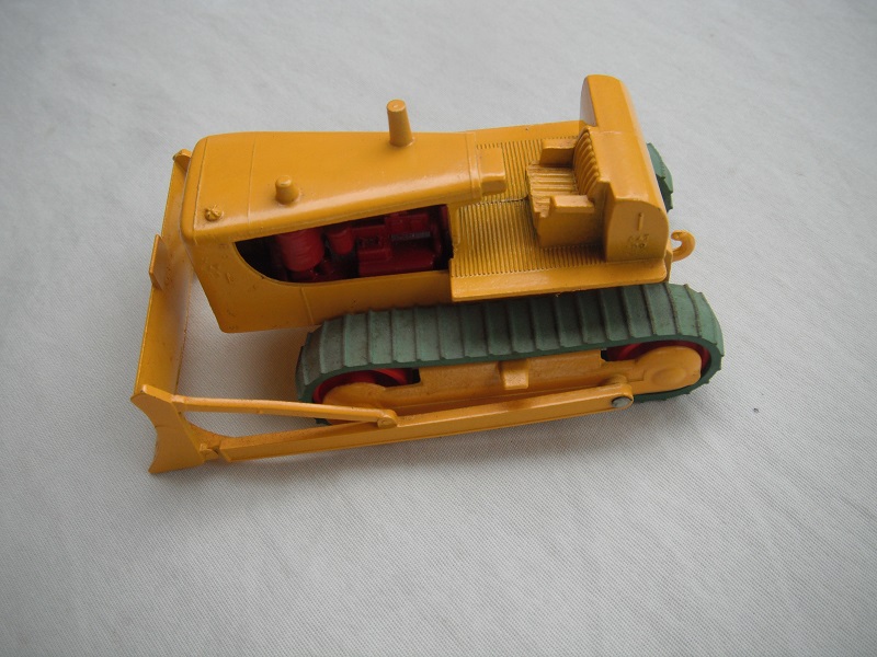 5. Dk.yellow body/with tow hook/red rollers/green tracks/dark red engine/Cat.D9 above blade.