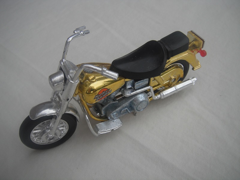 3. Gold body/unpainted motor/K-83 Thailand base/Harley Davidson &amp; orange circle.