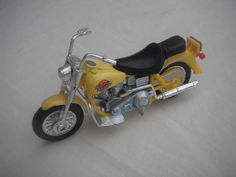 2. Yellow body/unpainted motor/K-83 Thailand base/Harley Davidson &amp; orange circle.