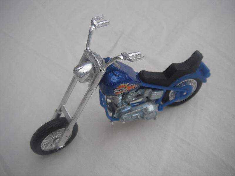 2. Dark blue body/unpainted motor/Thailand base/Harley Davidson &amp; flames.