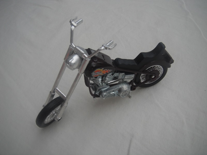 1. Dark brown body/unpainted motor/Thailand base/Harley Davidson &amp; flames.