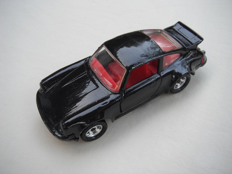 32. Black body/black base/red int/red steering/clear windows/no logos/China cast.