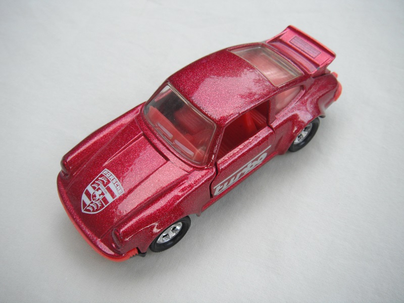 5. PP/Met.red body/black base/red interior/turbo on sides/large logo on hood/Macau cast.