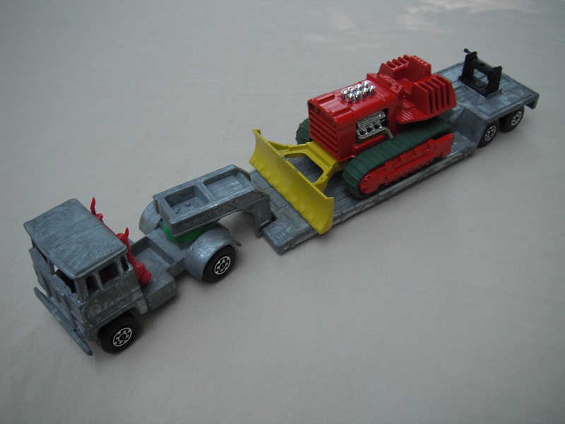 1.PP/Unpainted cab &amp; base/l.s./red insrt/brown xle cvr f.fwd/grn 5th whl/clr wind/red dozer w/grn tracks/bare metal tlr/wht open axle cover/blk plastics/all blk winch/RH crank.