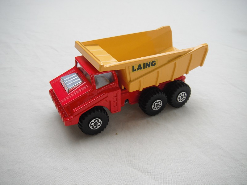 17.Orange-red body/dk.yellow dump type c/silver base type c/no press-o-matic/MC wheels/clear windows/Laing labels.