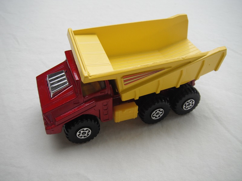 11.Dk.metallic red body/yel dump type a/silver base type b/yellow press-o-matic/MC wheels/amber windows/3 stripes labels.