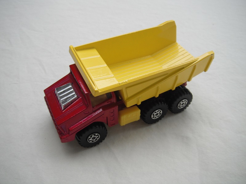 3. Metallic red body/yellow dump type a/silver base type a/dk.yellow press-o-matic/MC wheels/lt.amber windows/no labels.