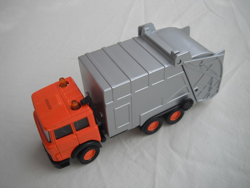 8. Orange cab/gray container/black base/China made/orange 8 dot disc whls/clr wind/blk int/no tampo.