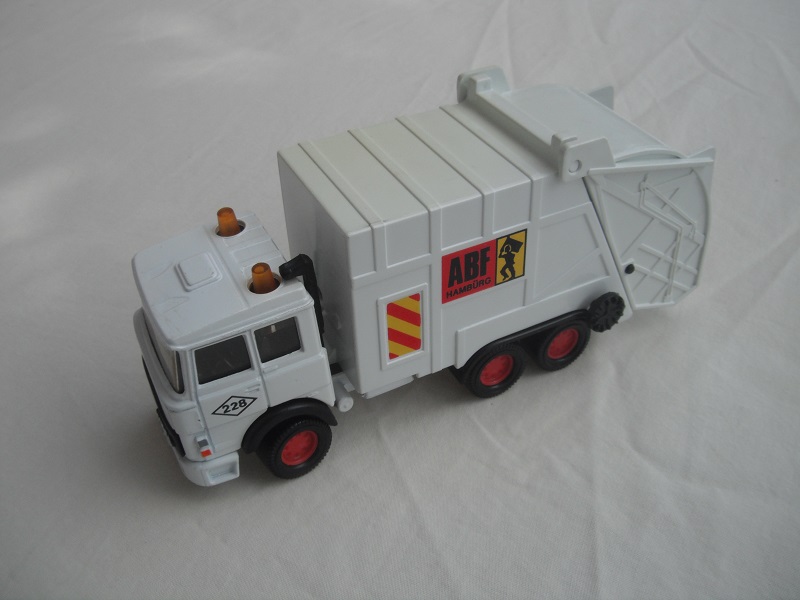 3. White cab &amp; container/white base/Macau made/red 8 dot disc whls/clr wind/blk int/&quot;ABF &amp; 228&quot;/orange &amp; yellow stripes.