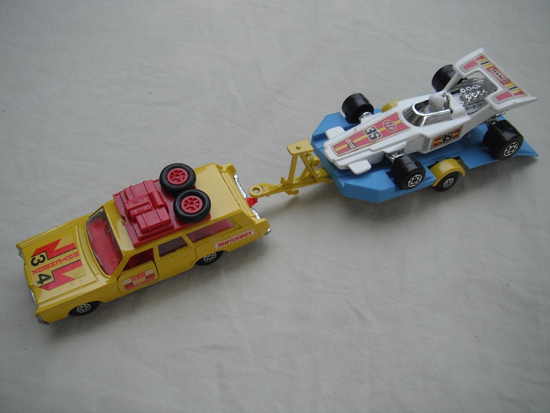 8. Yellow car/unpainted K46 base/spiro whls/clr windows/red int/red roof rack/yel &amp; blue king size tlr/spiro wheels/white race car &quot;35&quot;.