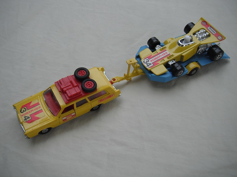 4. Yellow car/unpainted K23 base/spiro whls/clr windows/red int/dk.red roof rack/yel &amp; blue king size tlr/spiro whls/yellow race car &quot;34&quot;