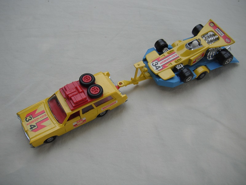 3. Yellow car/unpainted K23 base/spiro whls/clr windows/red int/red roof rack/yel &amp; blue king size tlr/spiro whls/yellow race car &quot;34&quot;.