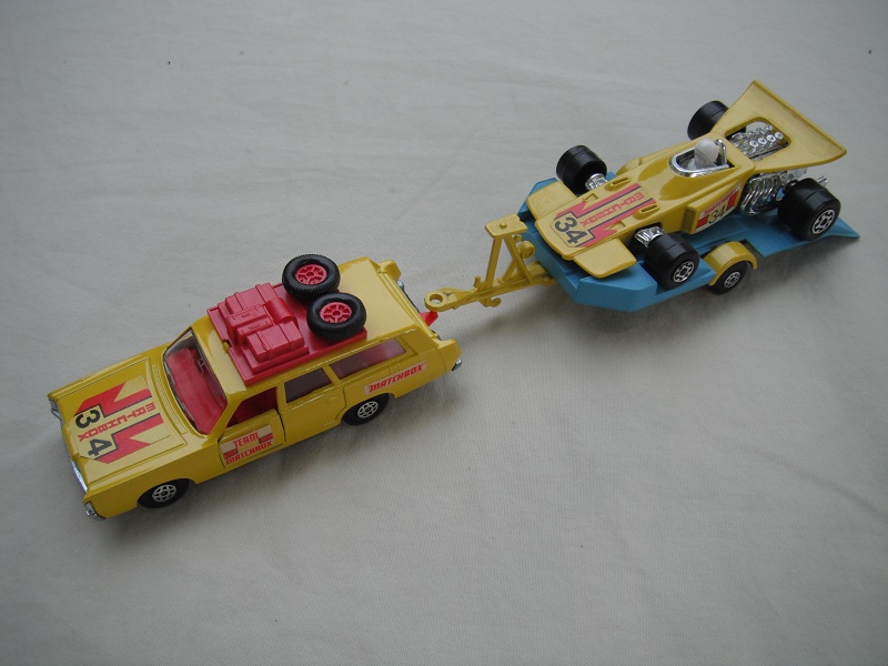 2. Yellow car/unpainted K23 base/spiro whls/clr windows/lt.red int/red roof rack/yel &amp; lt.blue king size tlr/spiro whls/yellow race car &quot;34&quot;.