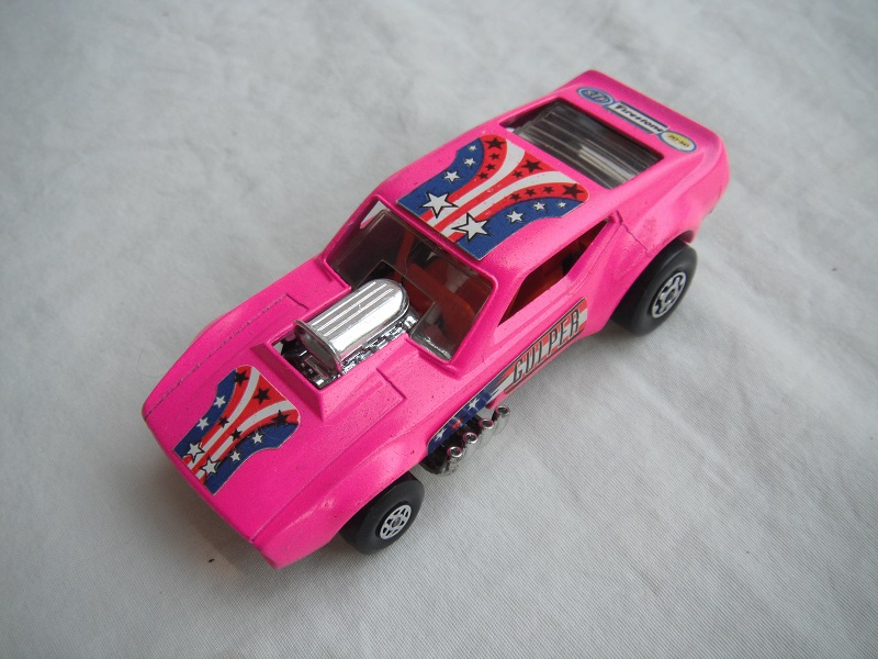 15.Darker pink body/cylinder shaped ES/blk base/spiro &amp; MC whls/clr windows/orange interior/orange cage/Gulper,stars &amp; stripes/dk.blu lbls.