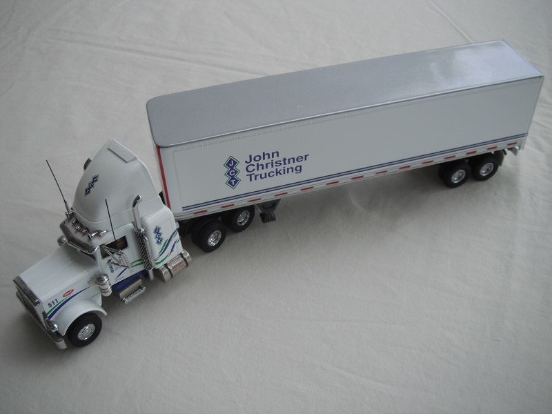 2. White cab/black chassis/black rubber tires/white container/gray chassis/&quot;John Christner Trucking&quot; tempa.