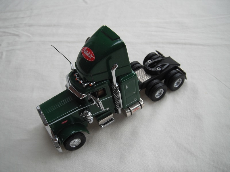 1. Dark green cab/black chassis/black rubber tires/&quot;Peterbilt&quot; tempa.