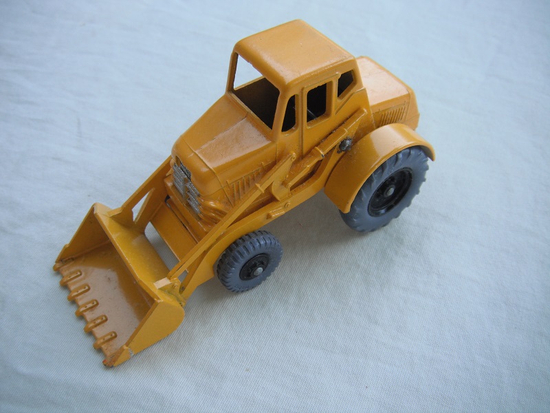 4. Yellow body/text on base/rectangular brace/black wheels w/gray plastic tires/Weatherill Hydraulic lt.green decals.