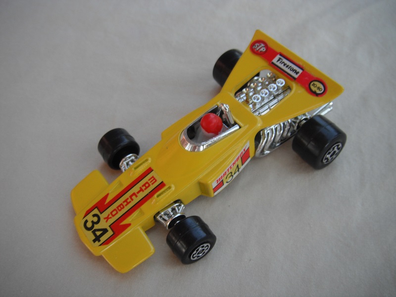 11.Yellow body/unpainted Speedkings base/wider rear wheels/white driver w/dk.red helmet/&quot;Matchbox 34&quot; yellow labels.